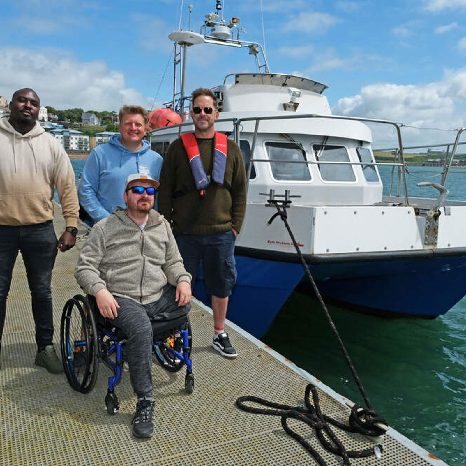 members-of-the-vc-gallery-prepare-to-enjoy-a-boat-trip-with-oliver-bird-from-blue-horizons-surf-school-centre-and-coxswain-at-the-port-of-milford-haven-graham-howells-right.jpg