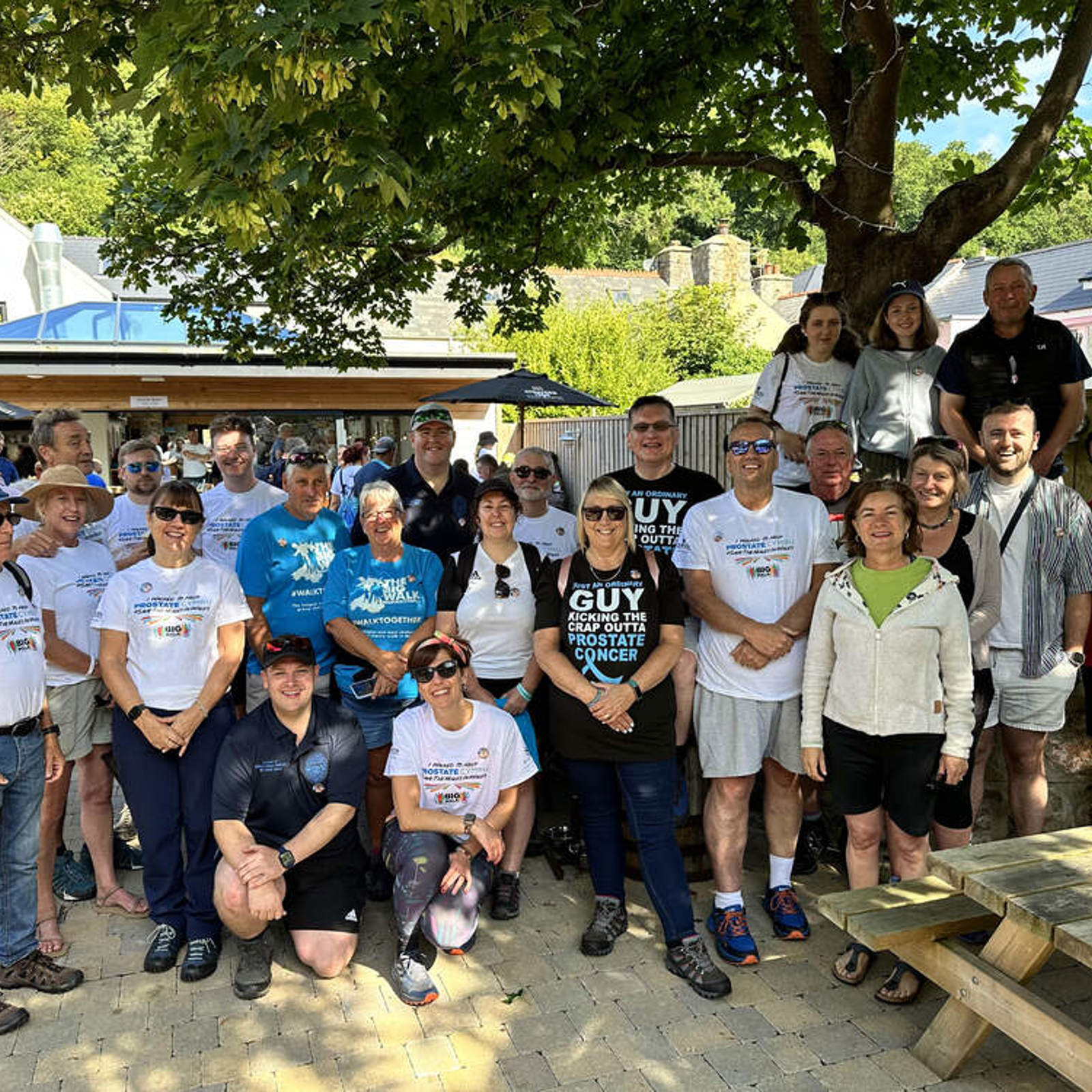 start-of-the-big-walk-last-summer-raising-money-for-prostate-cymru-guy-is-in-the-back-row-with-the-guy-t-shirt-he-is-pictured-with-friends-family-and-first-minister-eluned-morgan.jpg