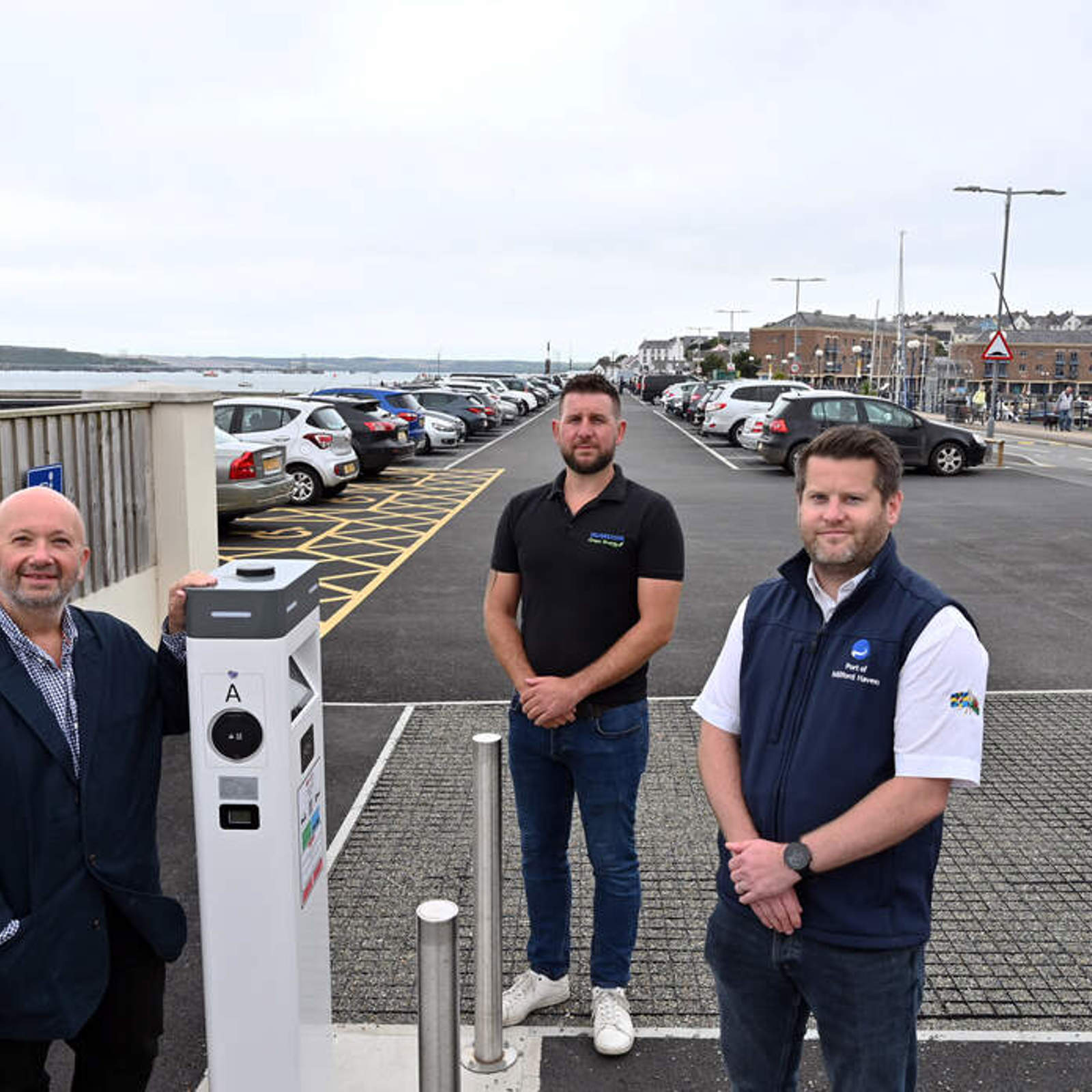 15-11-23-l-r-councillor-rhys-sinnett-andrew-mackay-and-gareth-phillips-at-the-newly-resurfaced-mackerel-quay-car-park.jpg